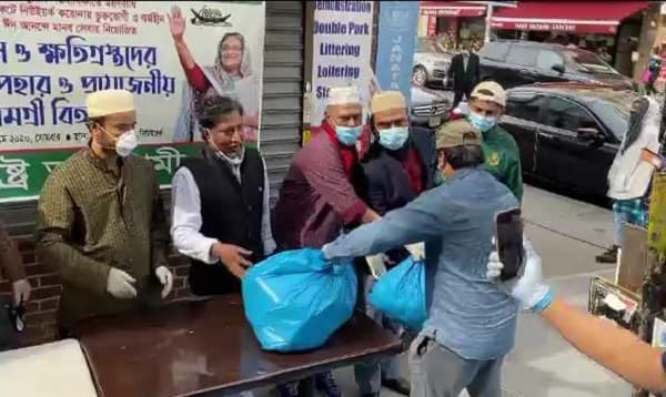 প্রবাসীদের ত্রাণ বিতরণ অব্যাহত